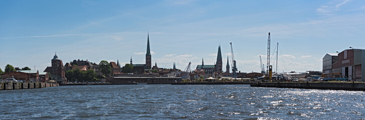 Fototapeta premium Panorama image of Hanseatic city of Luebeck with trave river, Luebeck, Germany