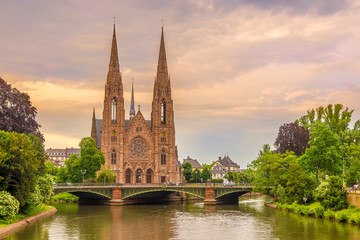 Fototapeta na wymiar View at the church of Saint Paul with river Ill in Strasbourg - France