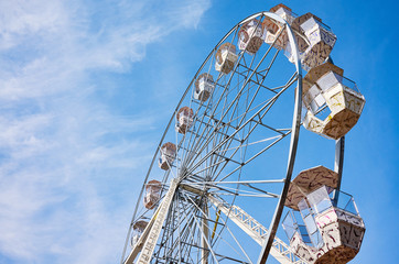 Picture of a Ferris wheel against the blue sky.