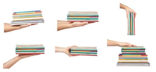 set of different Different colorfull books in stack with hand isolated on white background