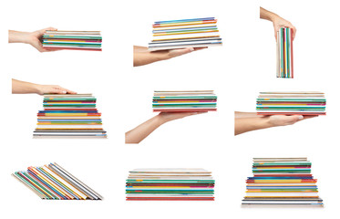 set of different Different colorfull books in stack with hand isolated on white background