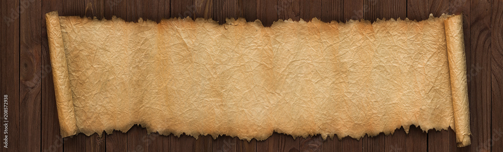 Wall mural panoramic background of old paper. unfolded scroll on the table