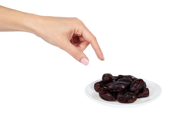Dried dates with hand on plate isolated on white background