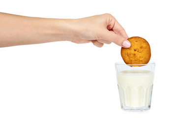 Glass of milk and homemade cookies with hand isolated on white background