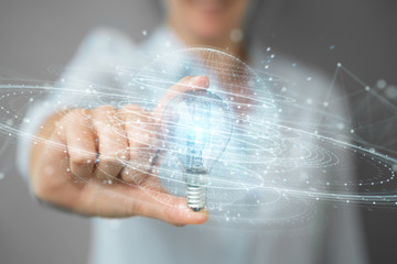 Businesswoman holding a lighbulb with connections in her hand 3D rendering