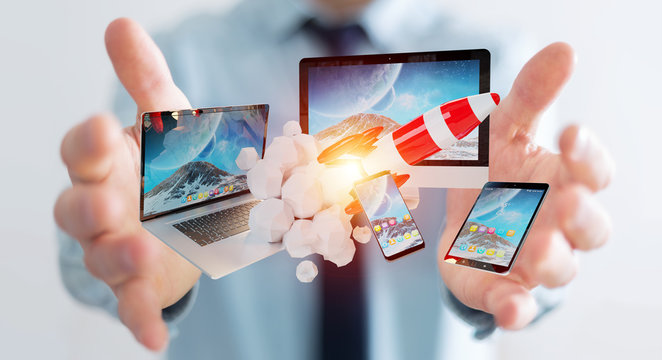 Businessman connecting tech devices and startup rocket 3D rendering