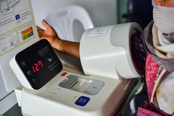 Patient measuring blood pressure in the hospital.