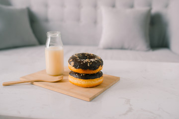 Bottle of milk and donuts, selective focus
