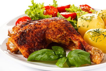 Roast chicken legs with boiled potatoes and vegetables