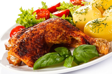 Roast chicken legs with boiled potatoes and vegetables