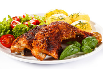 Roast chicken legs with boiled potatoes and vegetables