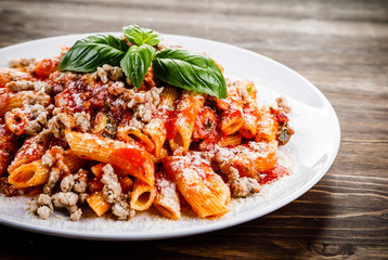 Penne with meat, tomato sauce and vegetables