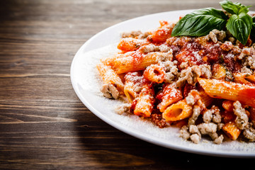 Penne with meat, tomato sauce and vegetables