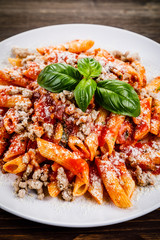 Penne with meat, tomato sauce and vegetables