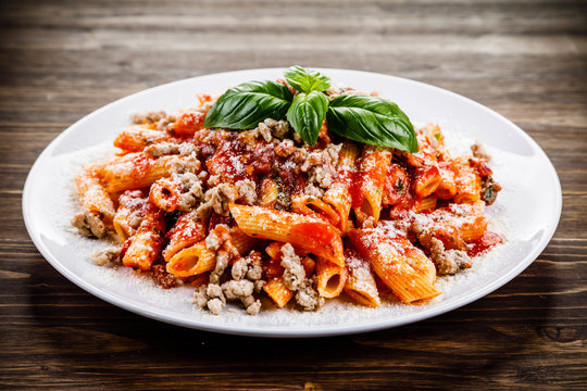 Penne with meat, tomato sauce and vegetables