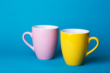 pink and yellow cup on a blue background