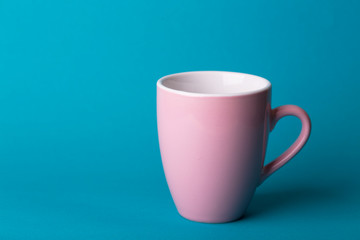pink cup on a blue background