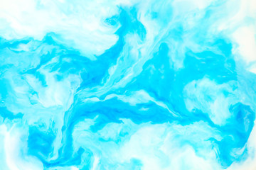 Coloring ink flowing and mixing in milk texture. background image