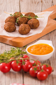 Meatballs with carrot purée.