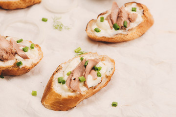 Bruschetta. Sandwich tuna fish salad on wooden background