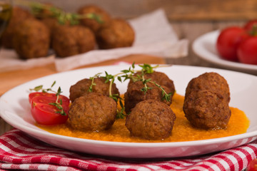 Meatballs with carrot purée.