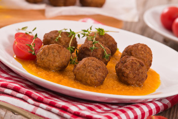 Meatballs with carrot purée.