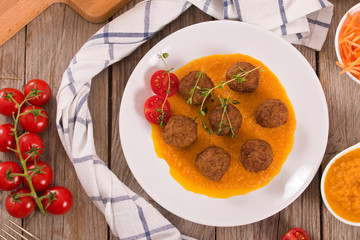 Meatballs with carrot purée.