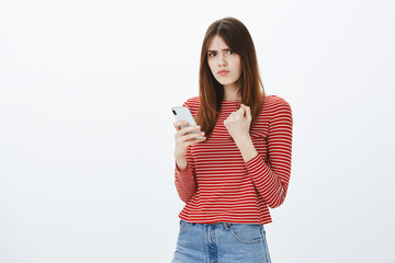 Boyfriend posted photo with ex girlfriend, revenge is near. Portrait of displeased angry pretty...