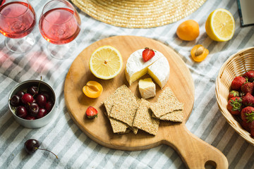 summer picnic in nature, fruit, berries, cheese