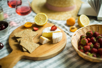 summer picnic in nature, fruit, berries, cheese