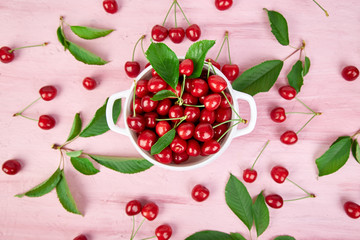 Red cherry in white bowl