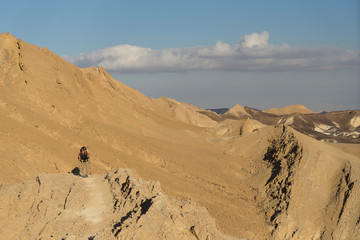 Fototapeta na wymiar Trekking in Negev dramatic stone desert, Israel
