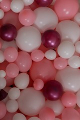 background texture balloons. a wall of balloons. pink and white balloons