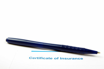 insurance document and blue pen 