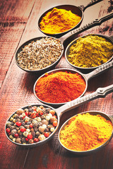 Wooden table of colorful spices.