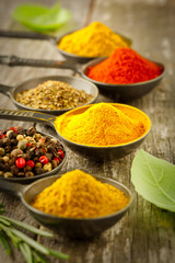 Wooden table of colorful spices.
