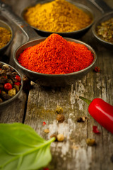 Wooden table of colorful spices.