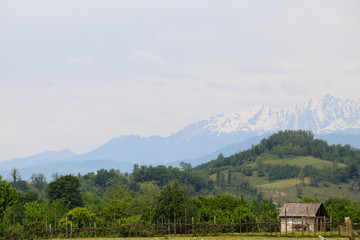 Old wooden barn in the village in Caucasus mountains