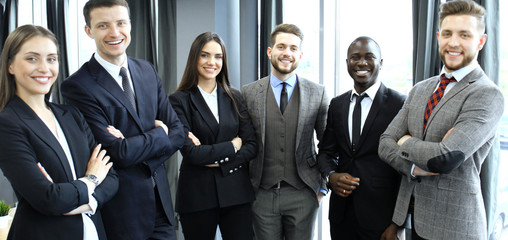 group of businesspeople standing together in office.