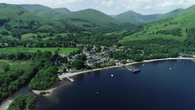 Aerial footage over the picturesque village of Luss on the banks of Loch Lomond.