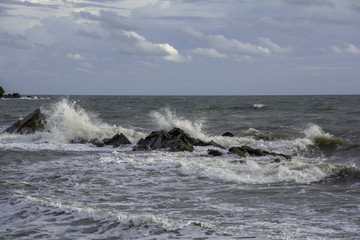 Scenic view of the waves breaking the rocks.