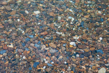 Colorful stones under the clear water of Lake Baikal, Russia.