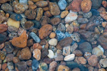 Colorful stones under the clear water of Lake Baikal, Russia.