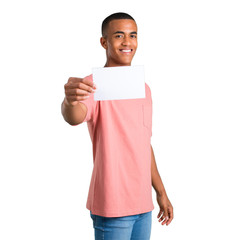 Young african american man holding an empty white placard for insert a concept on isolated white...