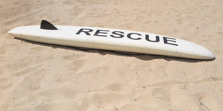 on sand beach surf board for rescue lifeguard