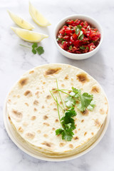 Homemade vegetarian tasty meal of tortillas, salsa and chickpeas.