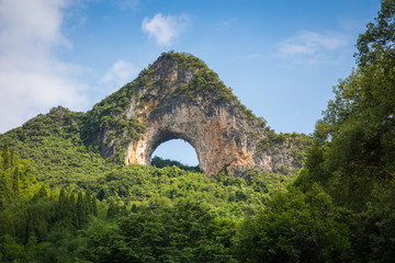 Fototapeta premium Scenic summer sunny landscape at Moon Hill, Yangshuo County of Guilin, China.