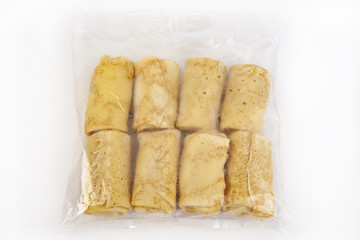 Semi-finished products. Frozen pancakes with cottage cheese in a tselofanovoy packing.
