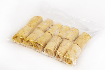 Semi-finished products. Frozen pancakes with cottage cheese in a tselofanovoy packing.