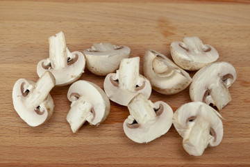 Fresh raw brown chestnut mushrooms on wooden background - top view